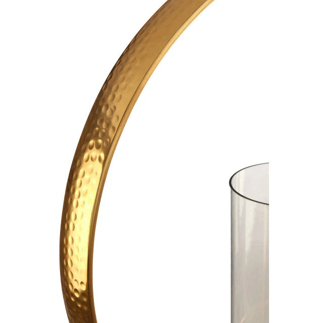 Close-up of Octave gold aluminium loop candle holder showing hammered metal texture and glass cylinder on white.