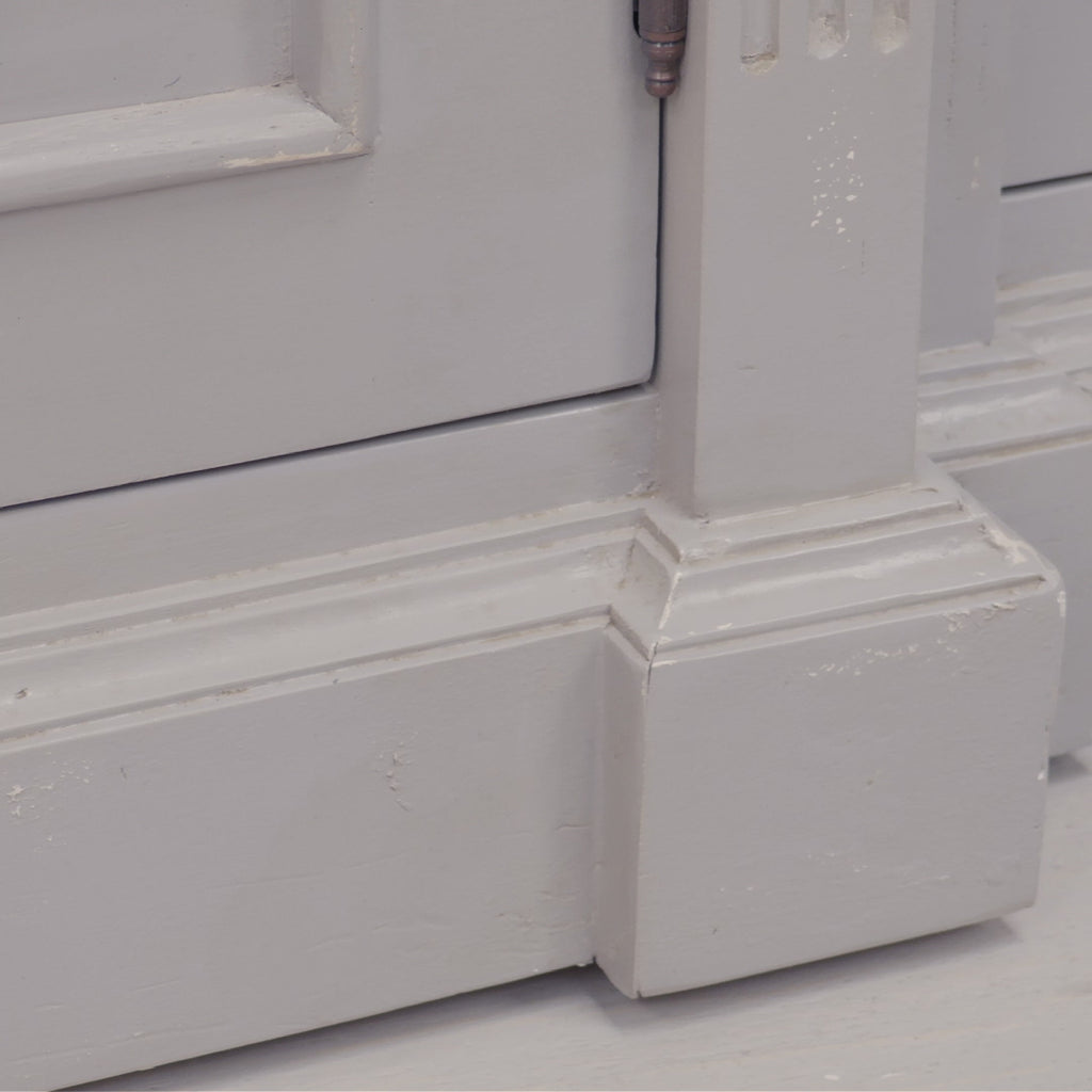 Video of Laurent distressed mahogany bookcase showing painted finish, panelled doors and decorative moulding on white