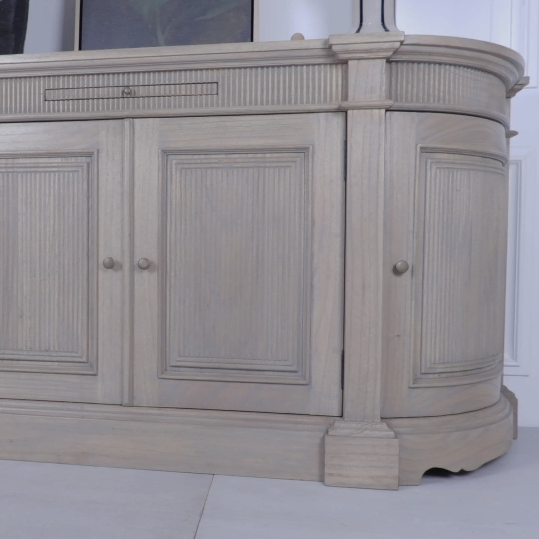 Product video of the Théodore Rustic Fluted Buffet Sideboard handcrafted from white cedar wood demonstrating the fluted detailing, curved cabinet design, pull-out serving shelf, spacious internal storage and artisan craftsmanship.