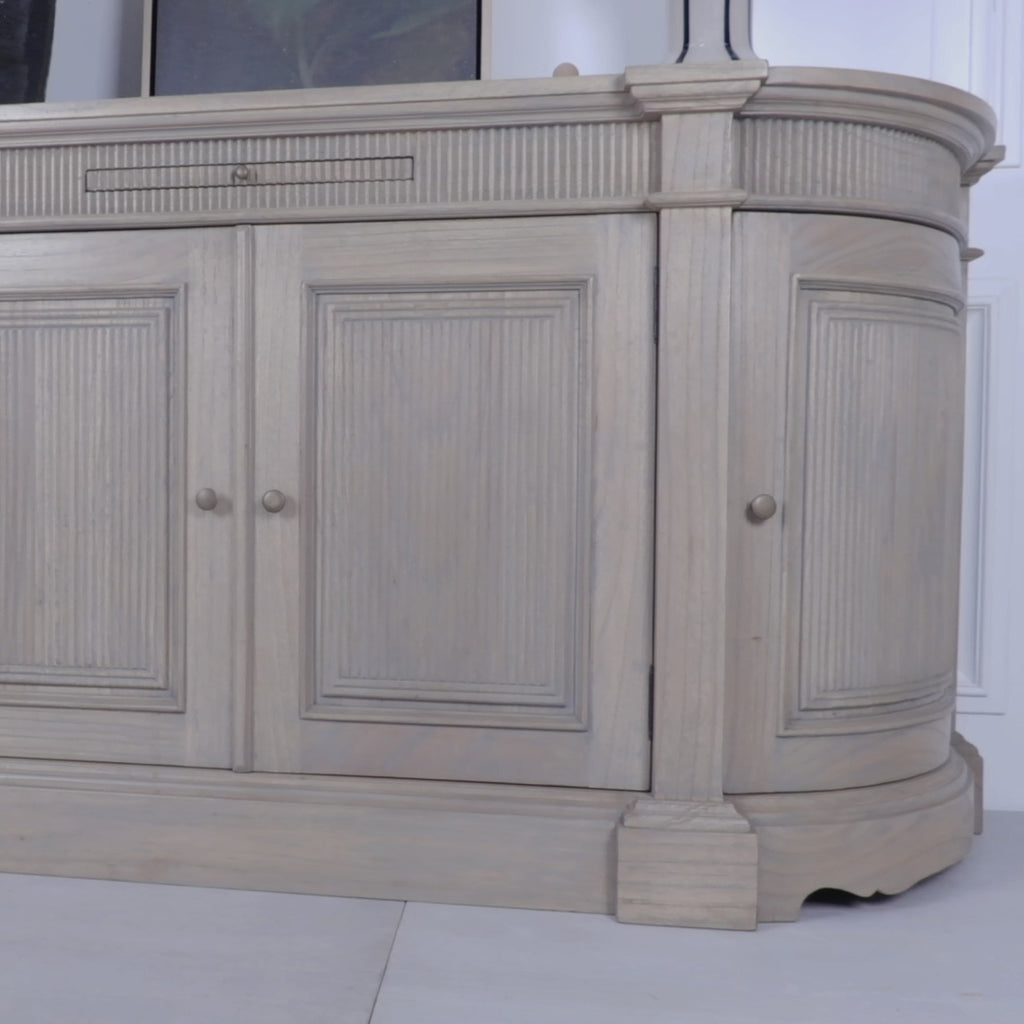 Product video of the Théodore Rustic Fluted Buffet Sideboard handcrafted from white cedar wood demonstrating the fluted detailing, curved cabinet design, pull-out serving shelf, spacious internal storage and artisan craftsmanship.