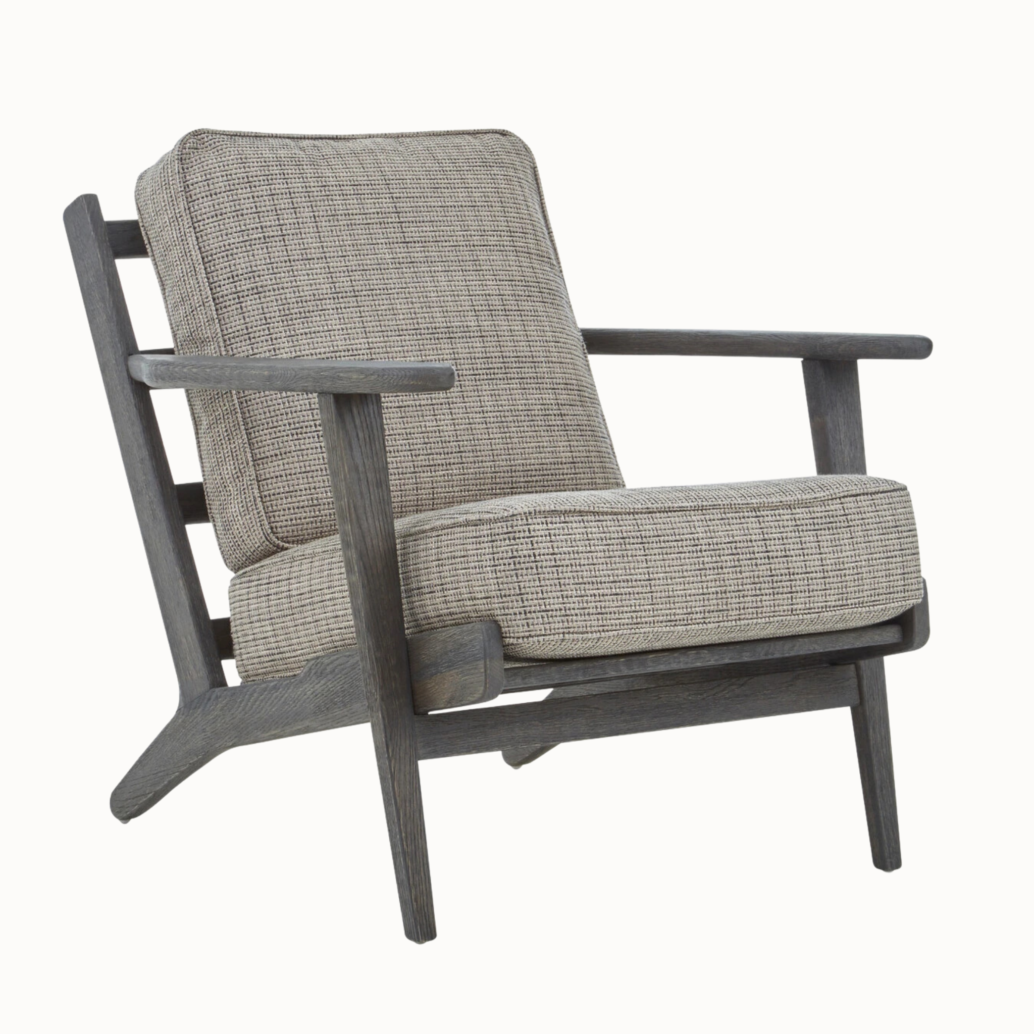 Angled view of Rémi grey tweed armchair with black American oak frame against a plain white background.