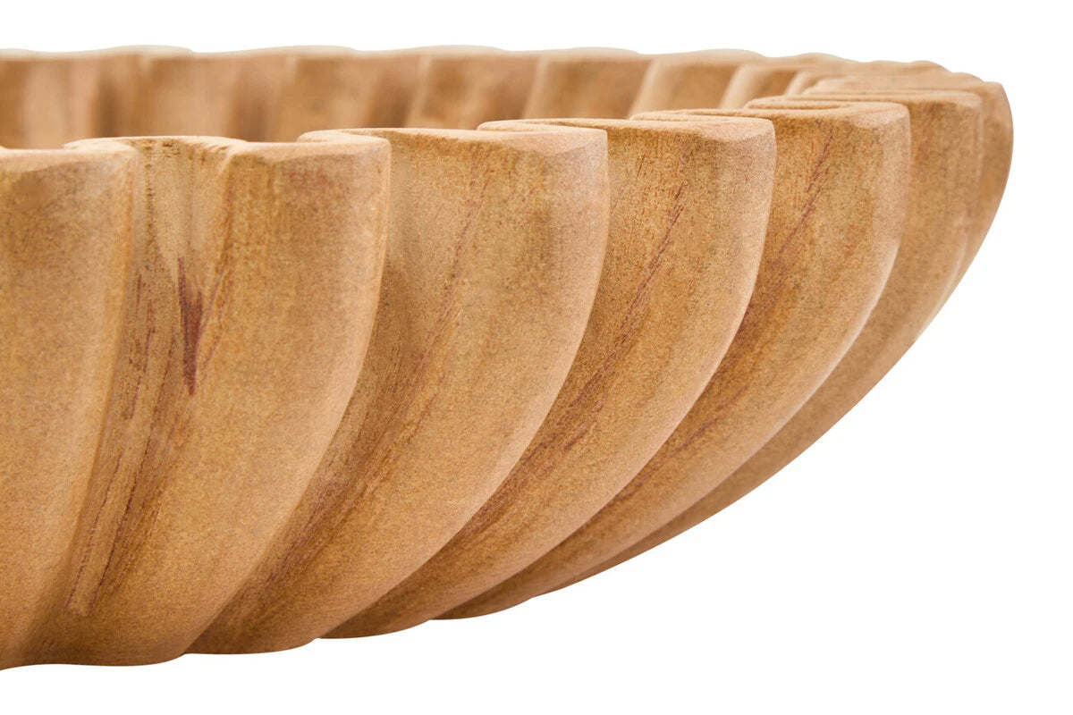 Close-up of Renaud 25cm ochre marble fluted bowl showing natural veining and sculpted rim against a white background.
