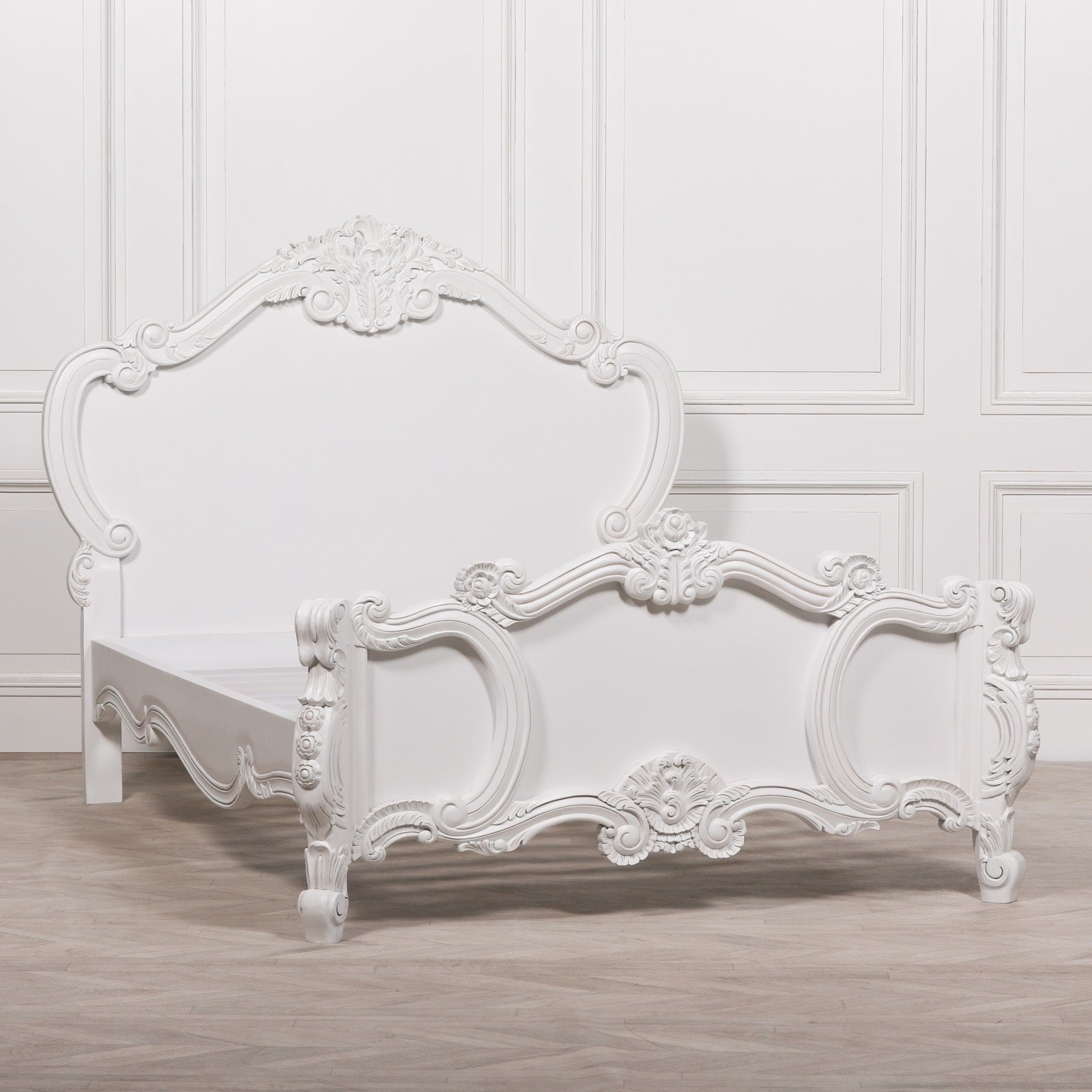 Rosalie French Rococo 4ft6 double bed frame showing the hand-carved headboard and footboard before assembly, finished in elegant light painted white with ornate French detailing.