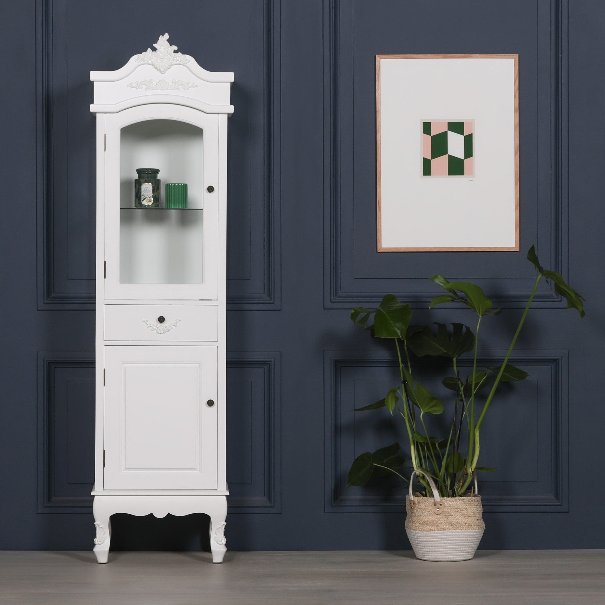 Rosalie Tall French Glass Display Cabinet with Drawer in Antique White styled in a luxury interior with decorative accessories, showcasing elegant French-inspired craftsmanship, glazed display cabinet, storage drawer and lower cupboard.