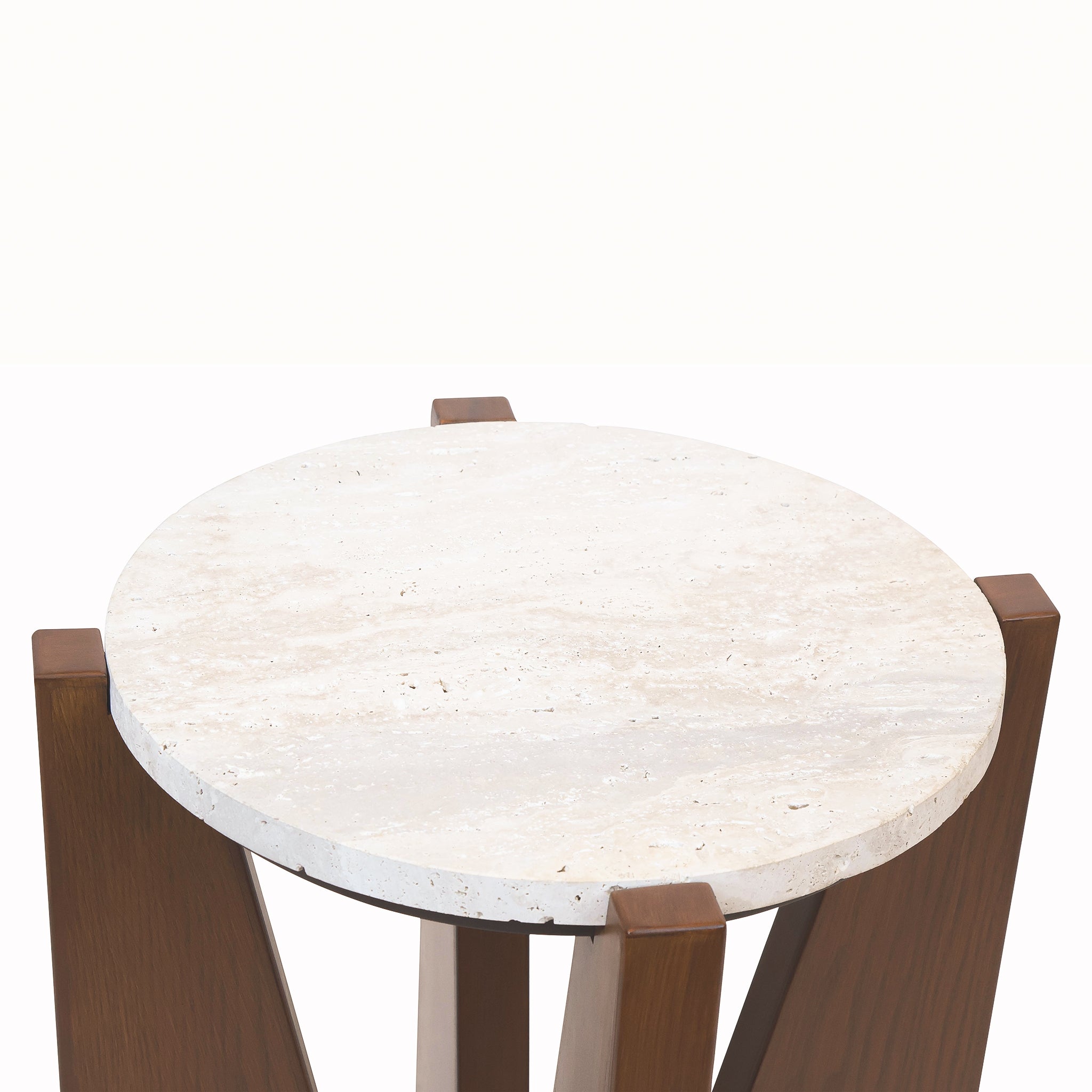 Elevated close-up of the Soline Side Table showing its round natural travertine surface and surrounding warm acacia wood frame