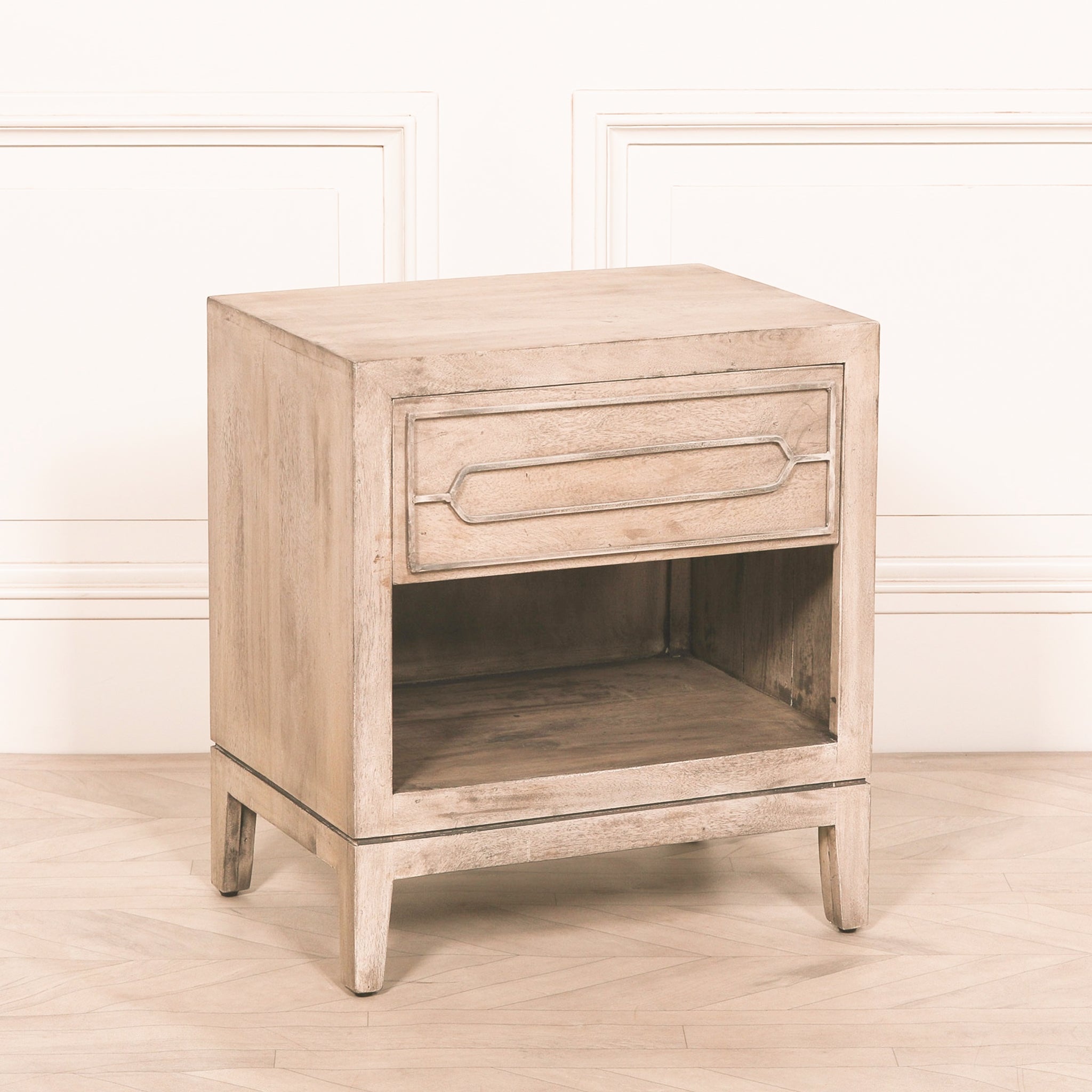 Angled view of the Soline rustic mango wood bedside table with drawer and lower shelf, showcasing its clean contemporary silhouette, solid mango wood frame, rustic finish and versatile bedside storage design.