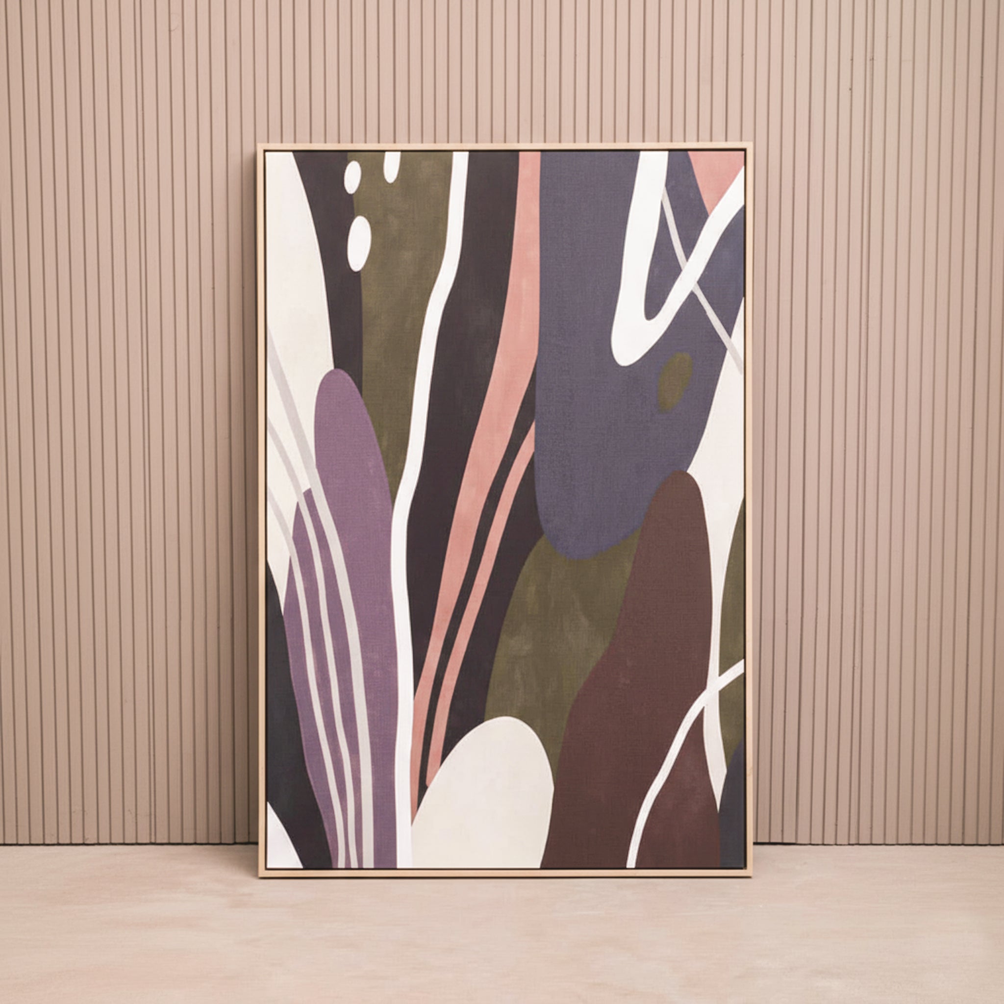 Solinea Abstract Multi Panel Canvas Wall Art displayed against a neutral fluted wall, featuring contemporary organic shapes in olive green, plum, brown, black, cream and muted terracotta tones within a slim wood-effect frame.