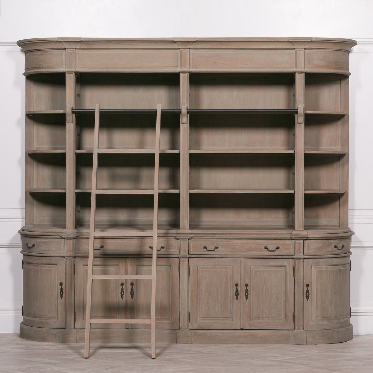 Front view of the Théodore Grand Library Bookcase with Ladder in Rustic White Cedar Wood featuring expansive open shelving, integrated wooden library ladder, lower storage cabinets, curved end units and handcrafted solid cedar wood construction for luxury home libraries and living rooms.