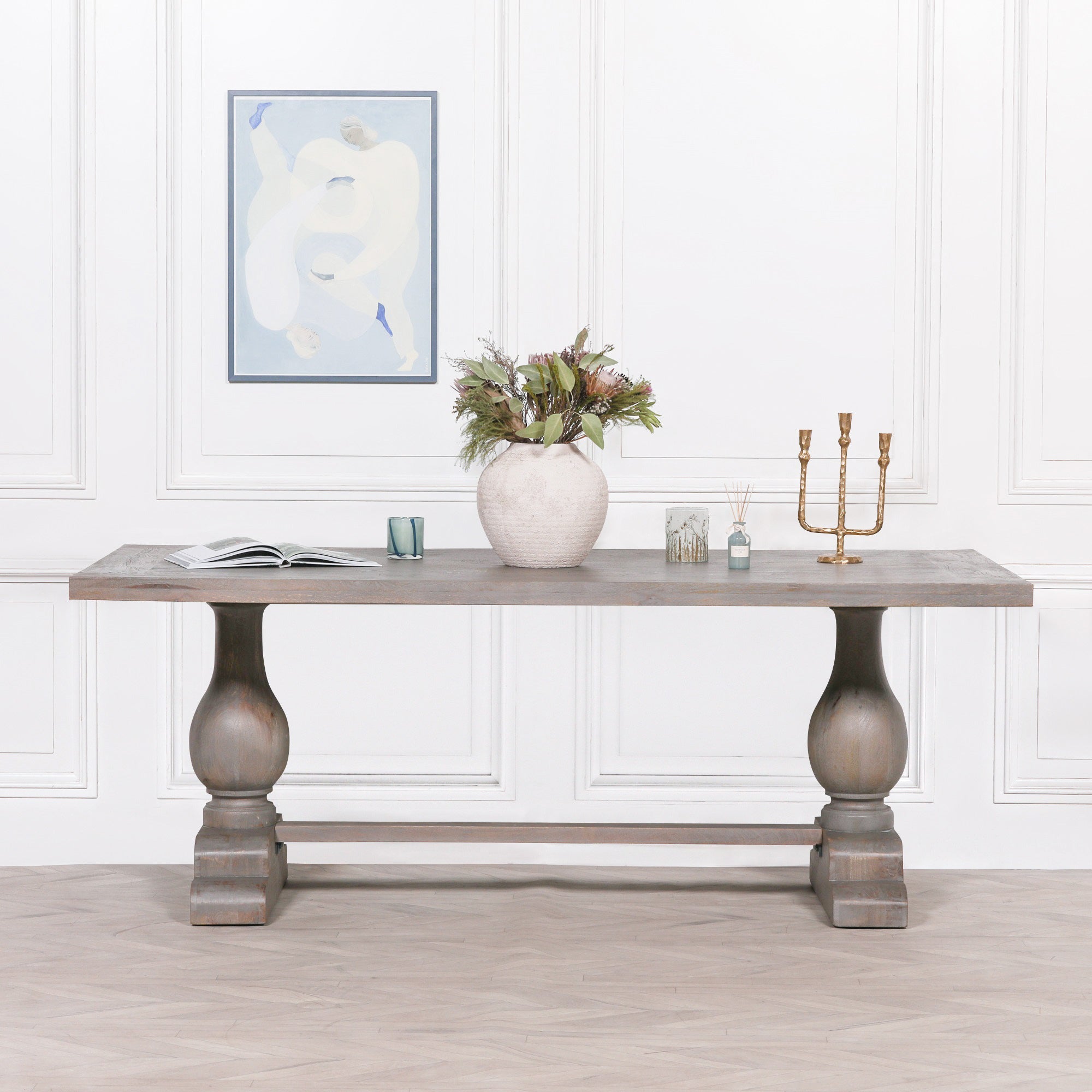 Front view of the Théodore Large Rectangular Dining Table 210cm for 8–10 in Rustic Mango Wood highlighting the spacious solid wood tabletop, twin turned pedestal legs, sturdy trestle stretcher base and classic farmhouse-inspired craftsmanship for contemporary dining spaces.