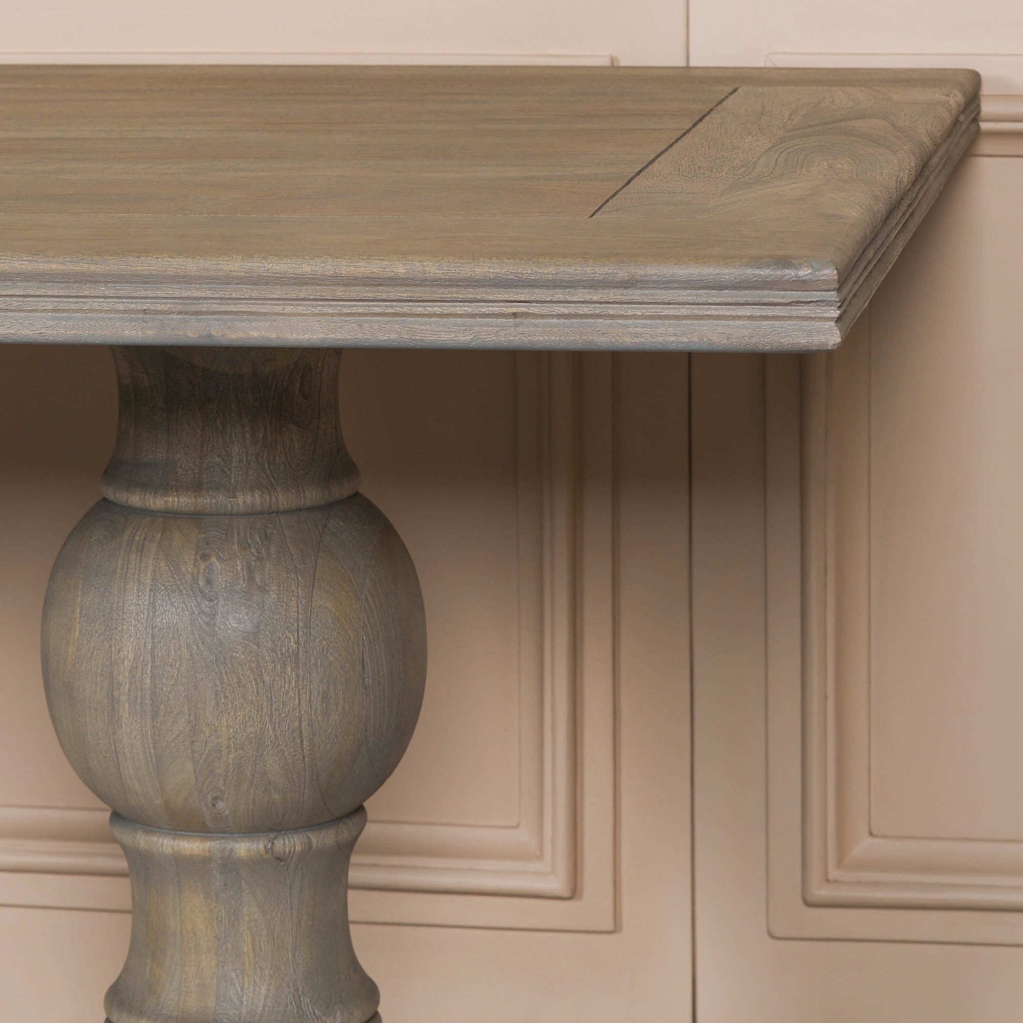 Close-up of the Théodore Large Rectangular Dining Table 240cm highlighting the handcrafted turned pedestal leg, solid Rustic Mango Wood construction, generous tabletop edge profile and traditional craftsmanship for premium dining room furniture.