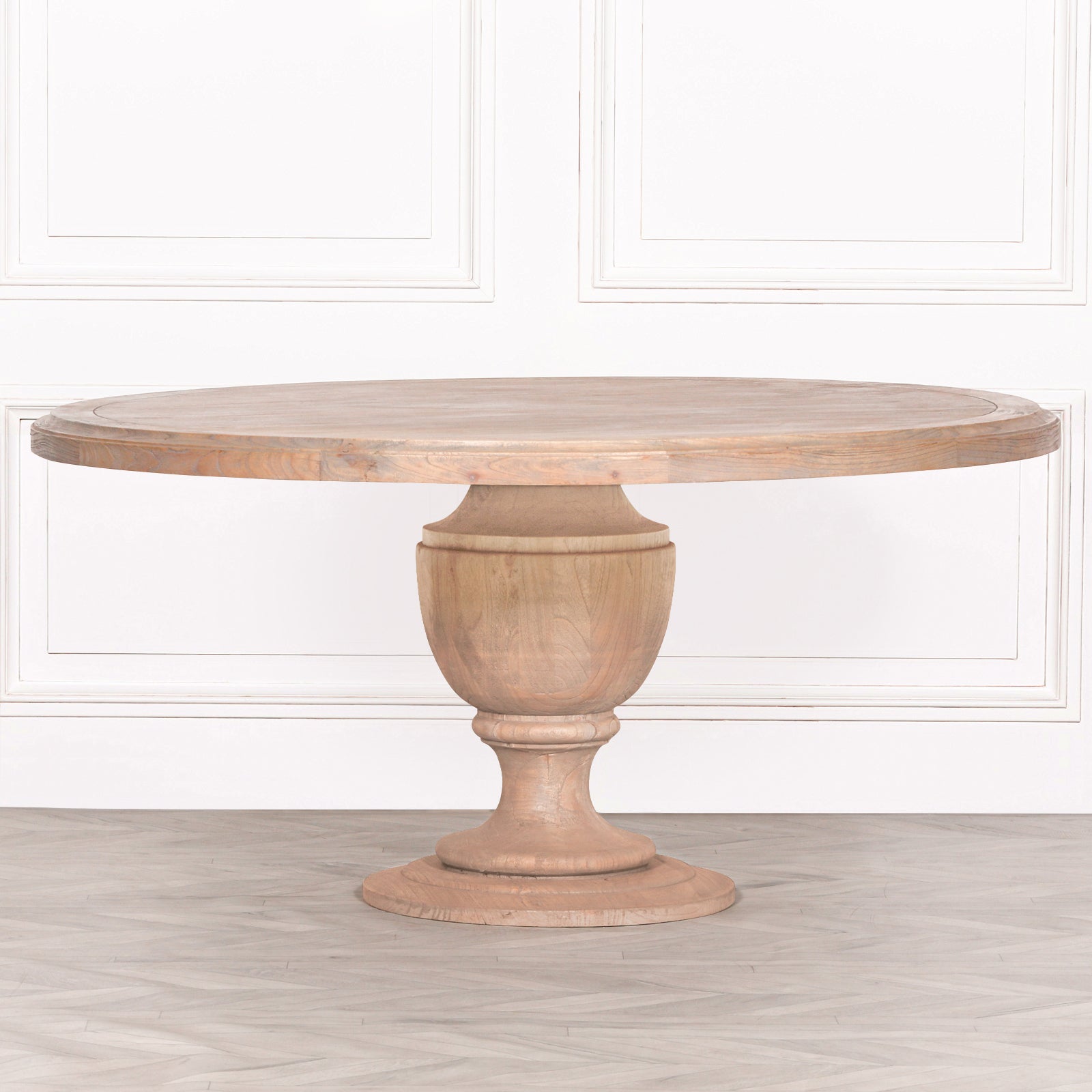 Front view of the Théodore Large Round Dining Table 162cm for 6–8 in Rustic Mango Wood featuring a generously sized round tabletop, handcrafted pedestal base, natural wood grain and substantial solid wood construction ideal for family dining and entertaining.