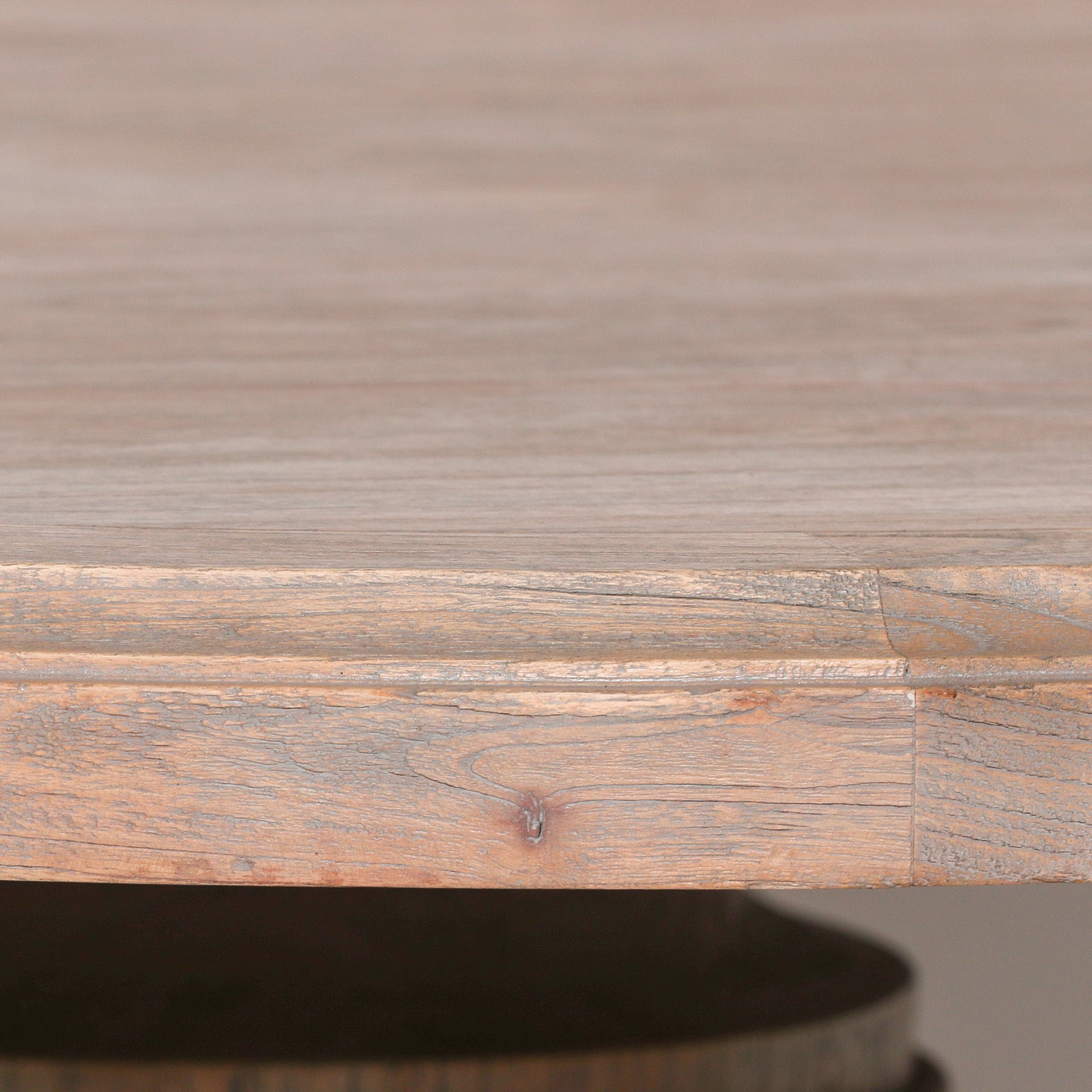 Close-up of the Théodore Large Round Dining Table tabletop highlighting the beautiful natural mango wood grain, thick solid wood edge, rustic finish and premium handcrafted craftsmanship designed for everyday dining and entertaining.