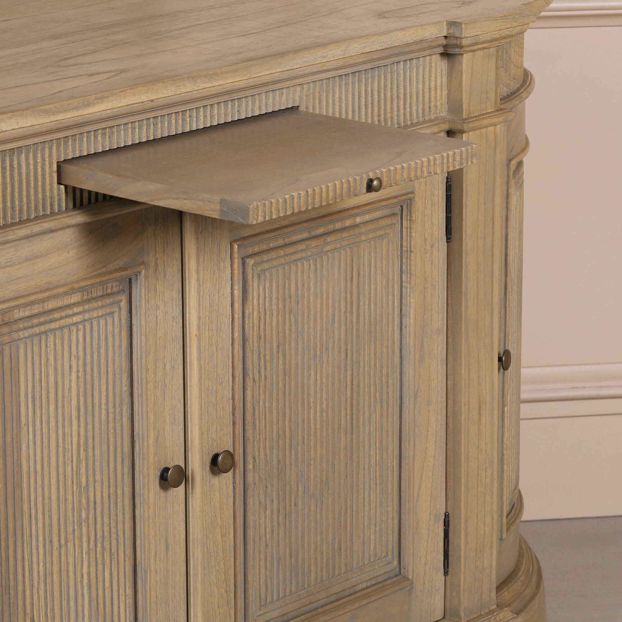 Close-up of the Théodore Rustic Fluted Buffet Sideboard with integrated pull-out serving shelf, hand-carved fluted detailing, white cedar wood construction and practical buffet storage design.