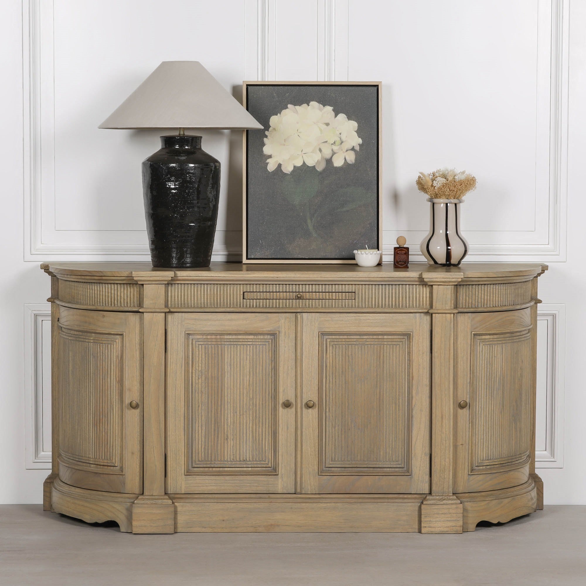 Théodore Rustic Fluted Buffet Sideboard styled with luxury home décor, handcrafted from white cedar wood with fluted detailing, curved silhouette and elegant storage for dining and living spaces.
