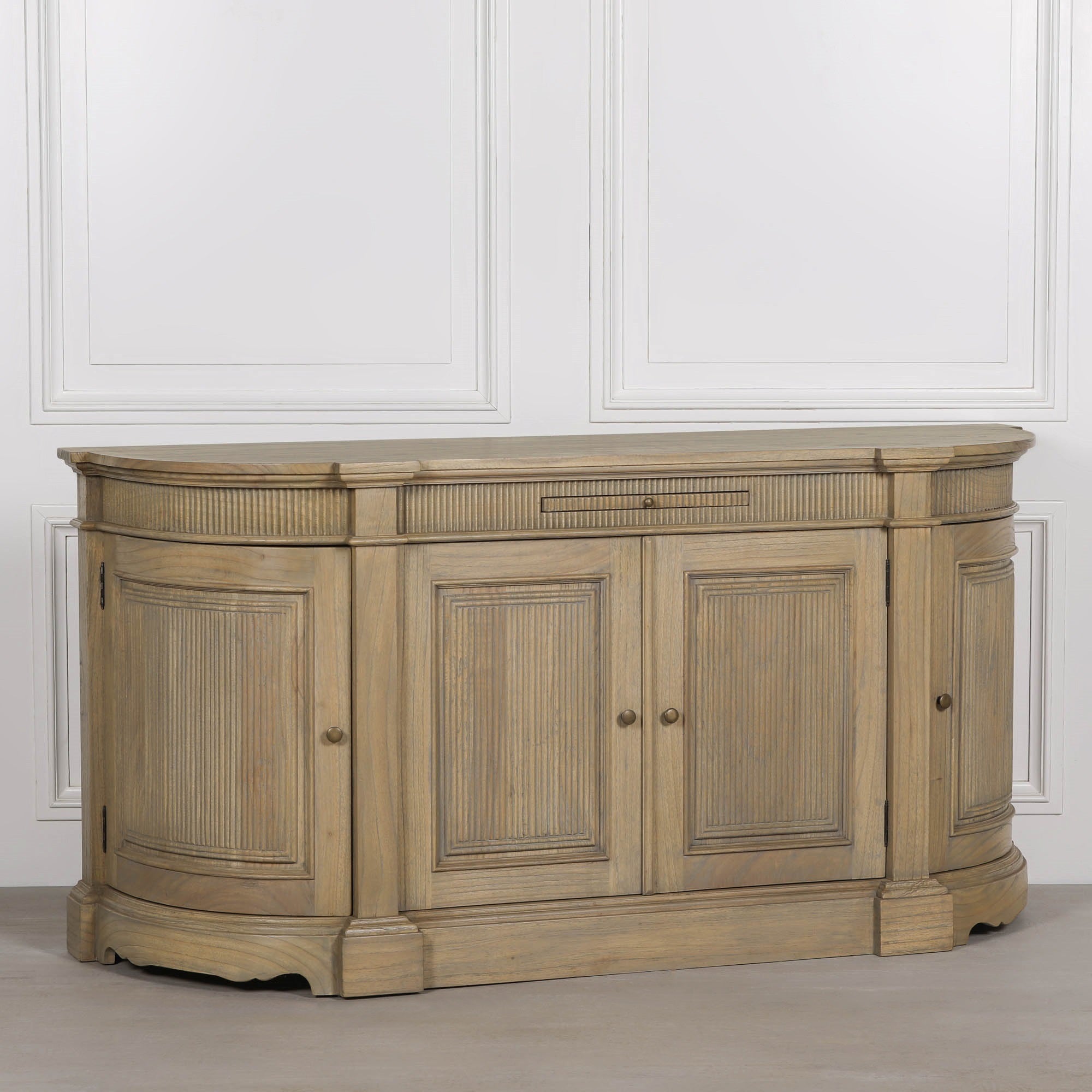 Three-quarter view of the Théodore Rustic Fluted Buffet Sideboard in hand-carved white cedar wood with fluted detailing, curved cabinet ends and generous concealed storage for luxury interiors.