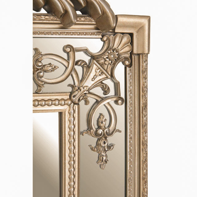 Close-up of the Valère Champagne Gilded Wall Mirror showing intricate floral scrollwork, beaded edging and ornate decorative detailing across the champagne-finish frame.