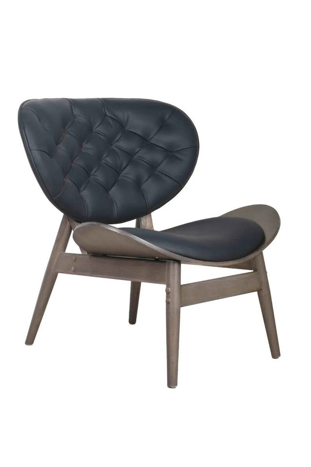 Three-quarter view of the Vincent Tufted Lounge Chair featuring premium black leather effect upholstery, deep button tufting, sculptural seat and solid elm wood frame for contemporary and mid-century interiors.