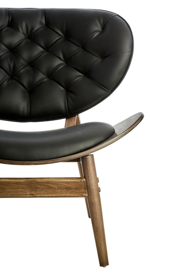 Close-up of the Vincent Tufted Lounge Chair highlighting luxurious black leather effect upholstery, deep button tufting, refined stitching and premium handcrafted detailing.