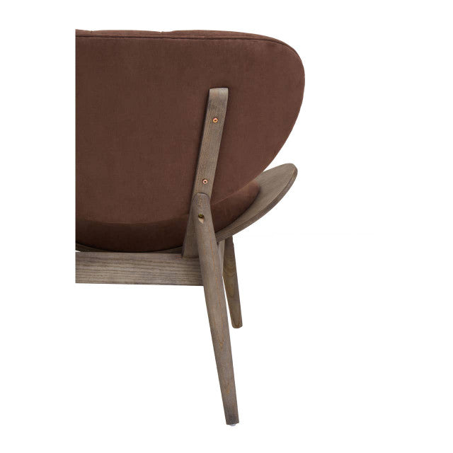 Rear angled close-up of the Vincent Tufted Lounge Chair highlighting the brown velvet upholstered backrest, exposed dark solid elm wood support frame, tapered legs and signature mid-century modern construction.
