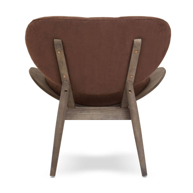 Rear view of the Vincent Tufted Lounge Chair showcasing the smooth brown velvet upholstered backrest, exposed dark solid elm wood frame, tapered legs and refined handcrafted construction.
