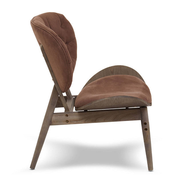 Side profile of the Vincent Tufted Lounge Chair highlighting the ergonomic curved seat, upholstered brown velvet backrest, dark solid elm wood frame and tapered legs in an iconic mid-century modern design.