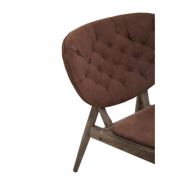 Close-up of the Vincent Tufted Lounge Chair highlighting the deep button tufted brown velvet backrest, supportive curved silhouette and handcrafted dark solid elm wood frame.