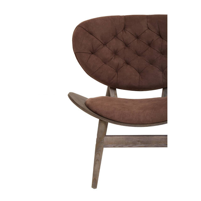 Detailed close-up of the Vincent Tufted Lounge Chair featuring soft brown velvet upholstery, sculpted seat, curved dark solid elm wood frame and premium handcrafted joinery.