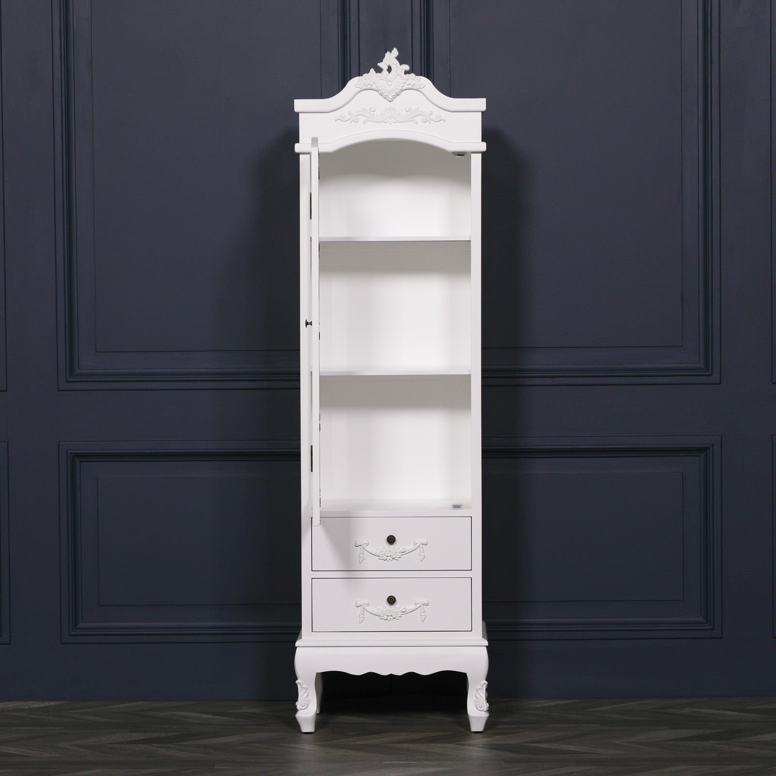 Vivienne tall white armoire interior with open shelving and 2 drawers against a dark navy panelled wall.