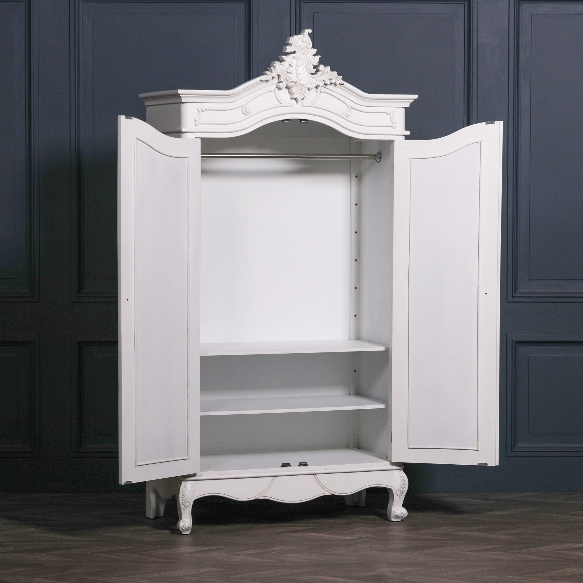 Vivienne White Carved Mirrored Double Door Armoire Wardrobe with doors open revealing the spacious hanging rail, adjustable shelving, generous internal storage and elegant French-style bedroom organisation.