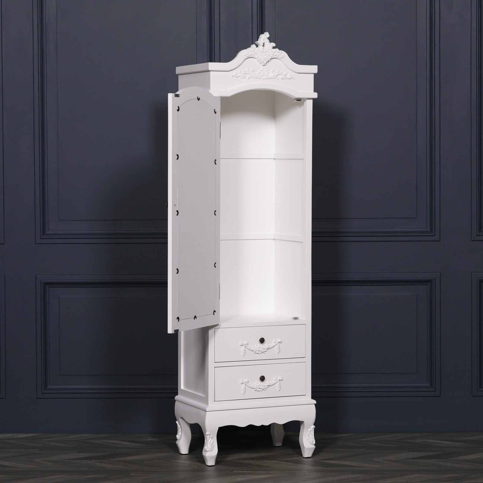 Vivienne white mirrored armoire shown open with shelving and 2 drawers against a dark navy panelled wall.